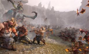 Warhammer 3 capture, a clash between chaos warriors and ogres.