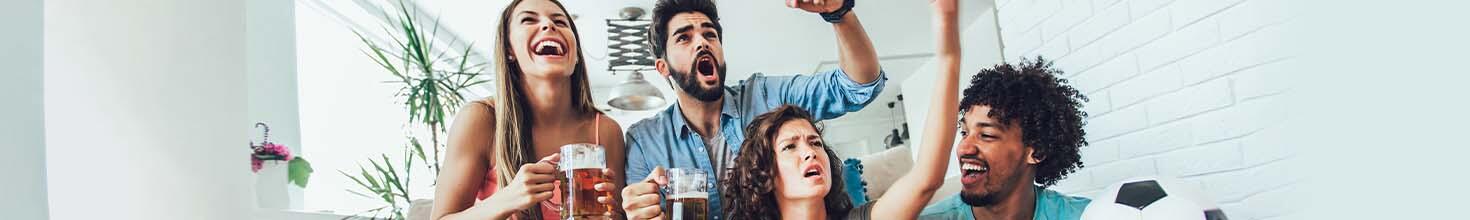 Sports fans with varying emotional expressions watch a sports game together. 